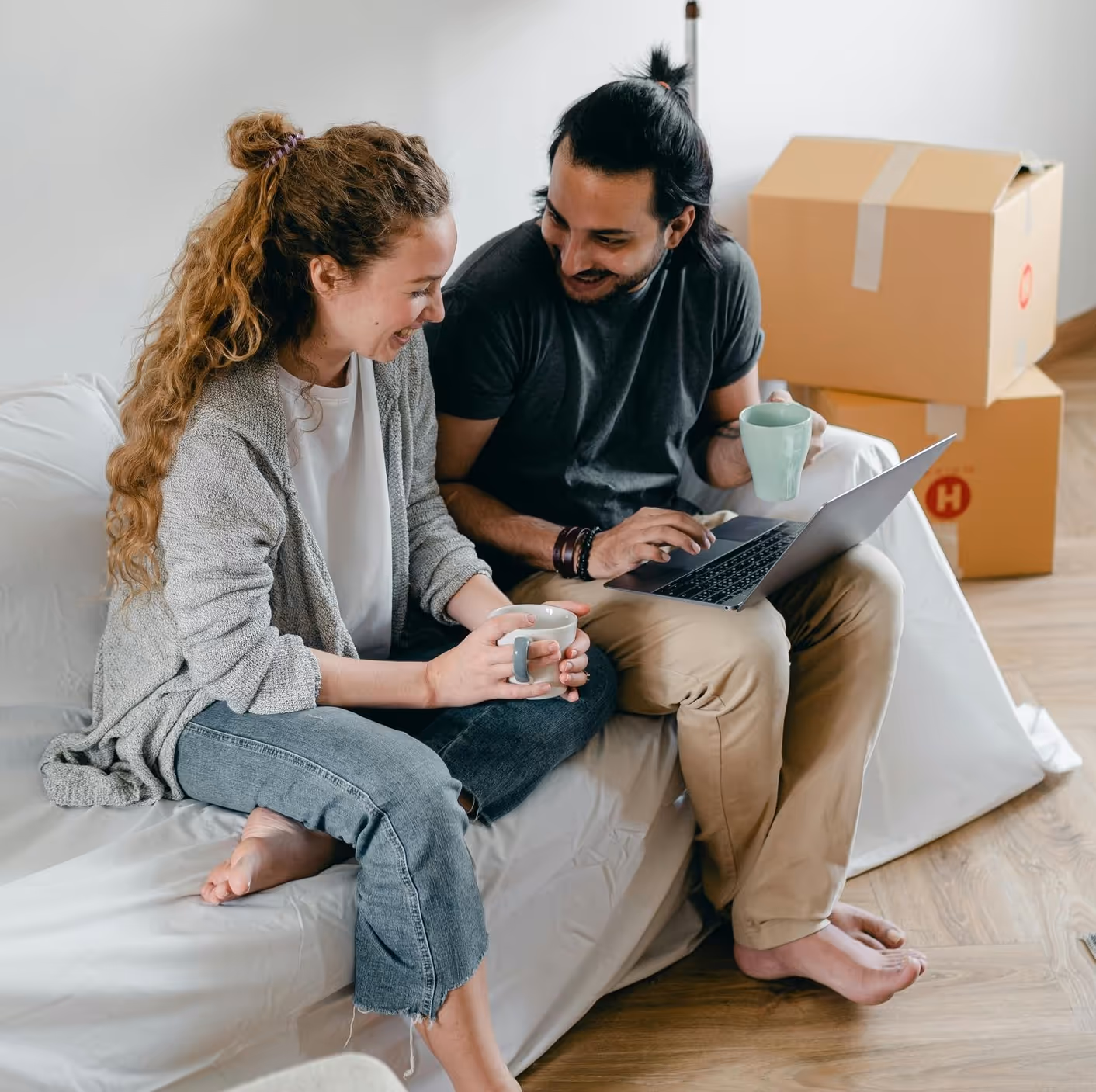 young couple with moving boxes