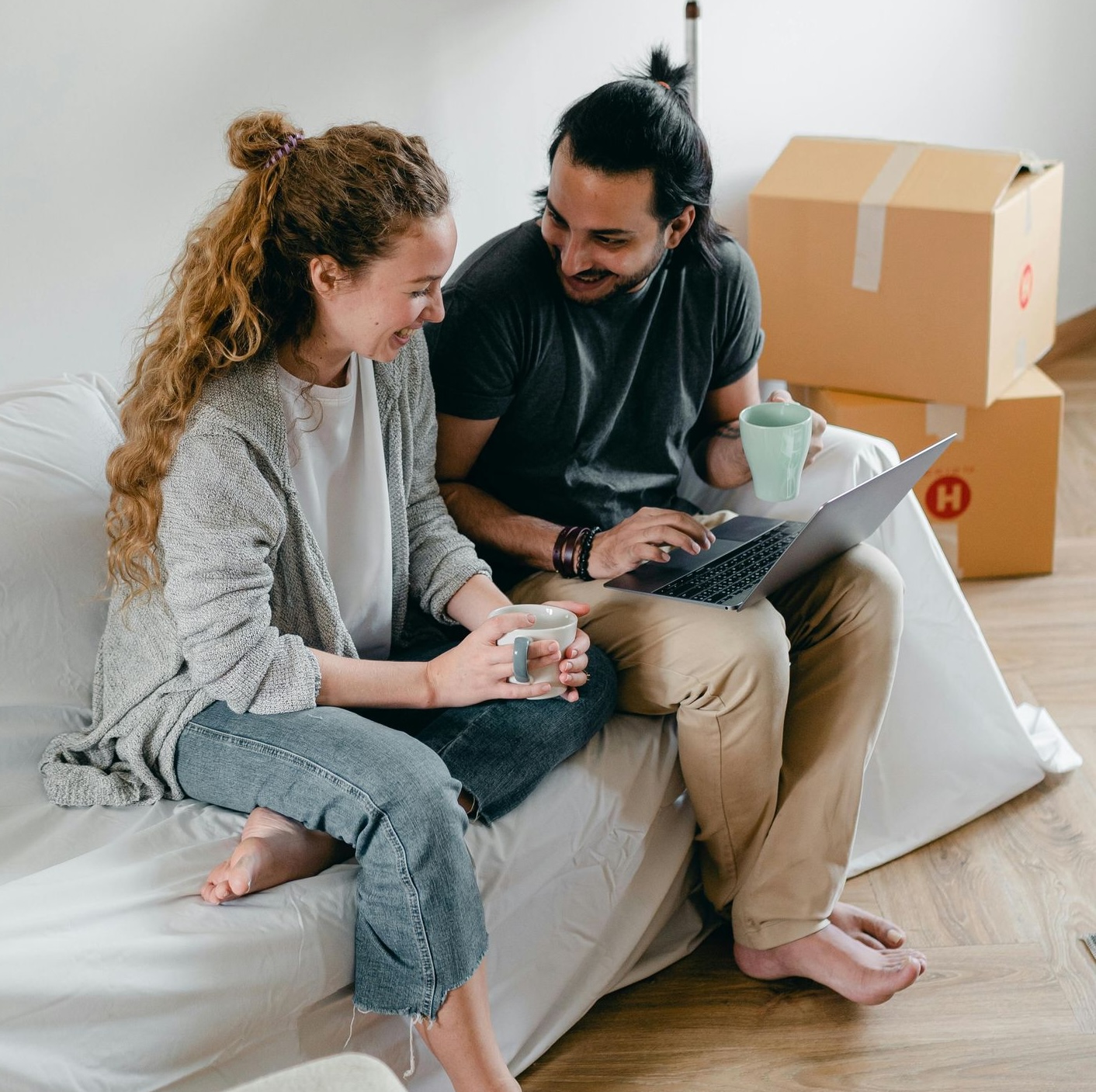 young couple with moving boxes